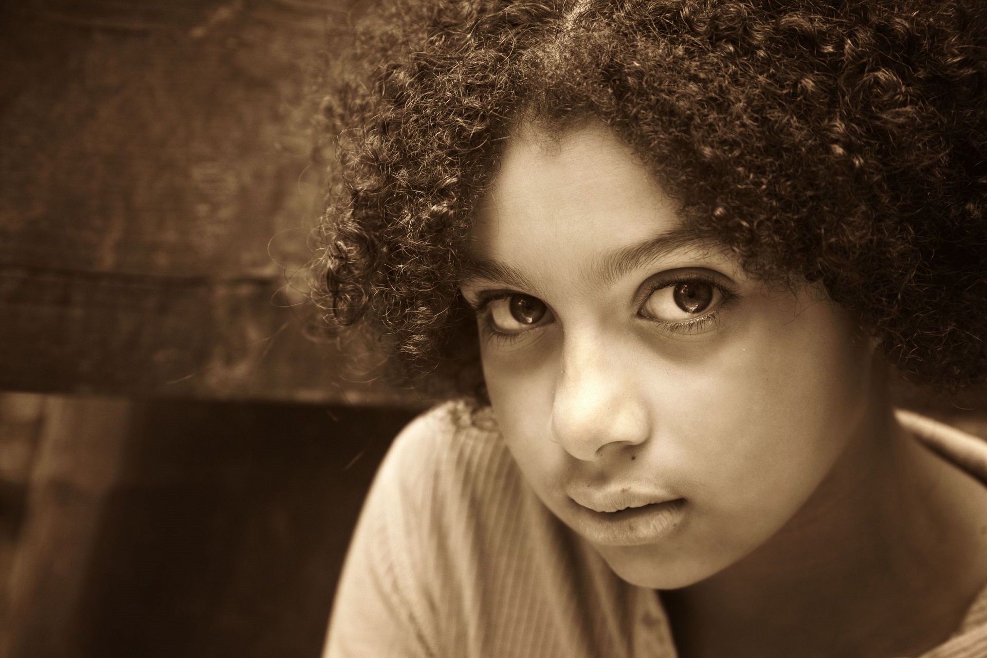 An image of a young girl staring directly at the camera.